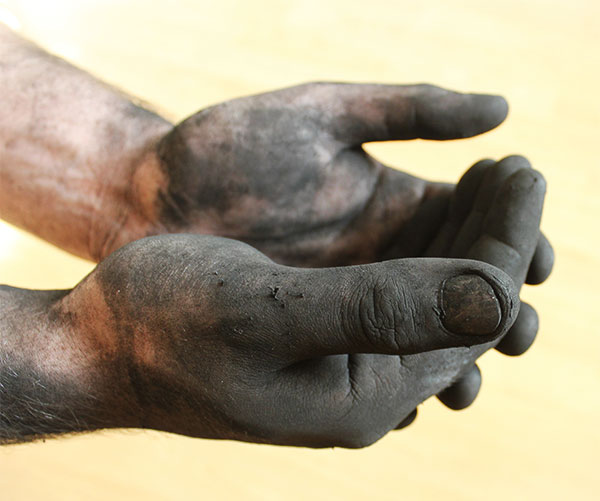 Soot Covered Hands After Touching A Dirty Chimney