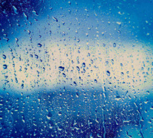 Raindrops on Window blue color to background