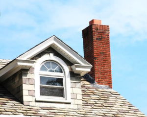 Chimney on Roof next to window on home