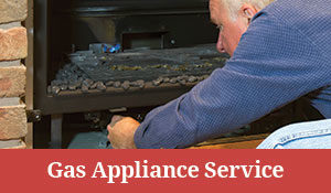 Man repairing Gas Fireplace Appliance