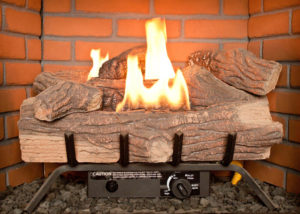 Gas Fireplace burning with Bricks in background